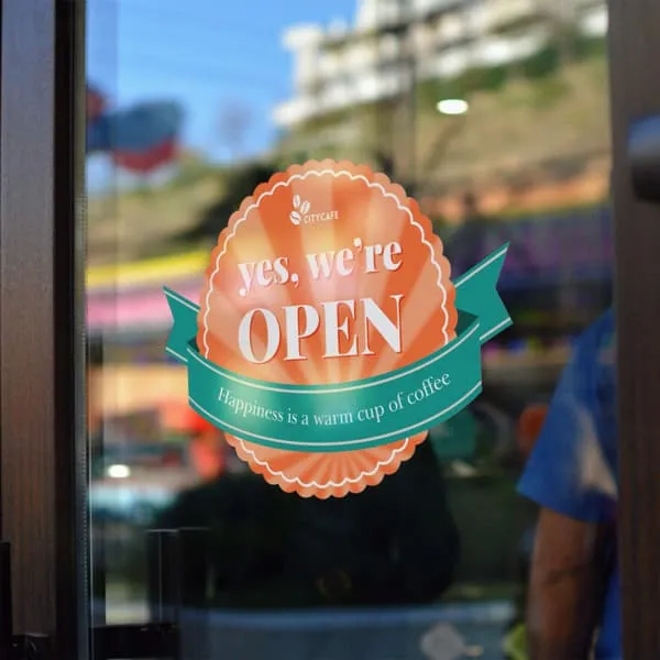 Custom printed glass sticker on a shop window for business branding